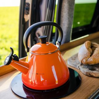 The interior of the van, featuring a kettle