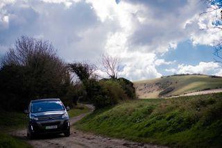 Eve driving along a countryside road